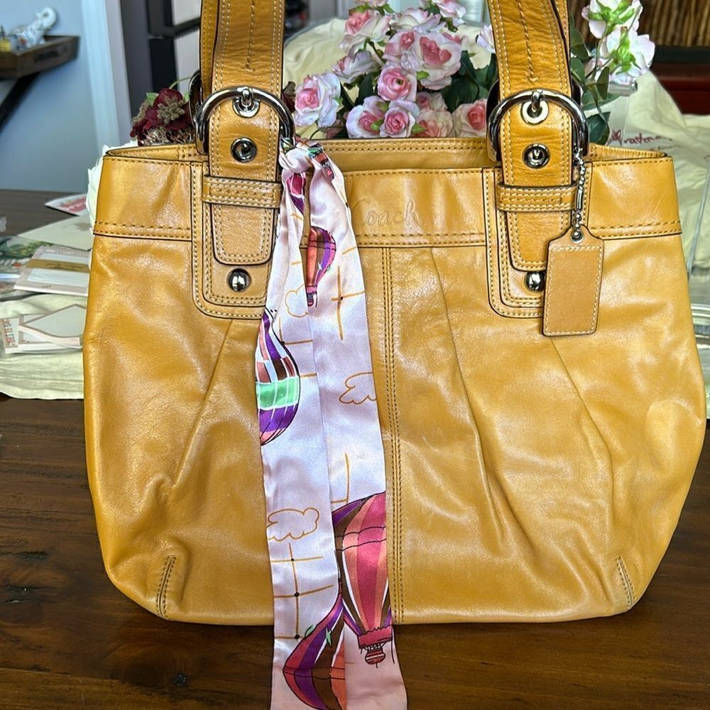 Coach shoulder bag Yellow color with twill  added to it silver hardware